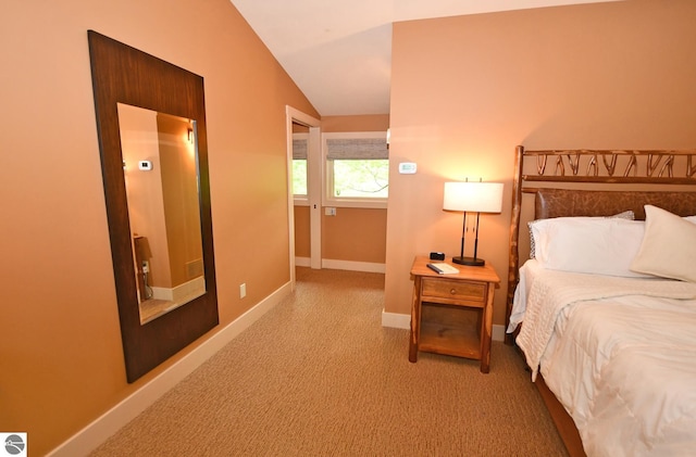 4365 W Burdickville Rd, Maple City, MI 49664 - carpeted bedroom featuring lofted ceiling and baseboards