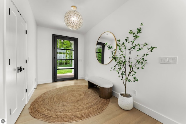 6848 S Carol Ann Dr, Traverse City, MI 49684 - entryway featuring light wood-style floors and baseboards