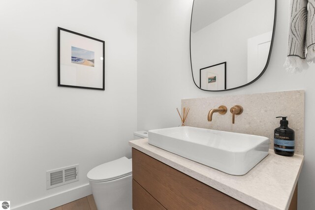 6848 S Carol Ann Dr, Traverse City, MI 49684 - bathroom featuring vanity and toilet