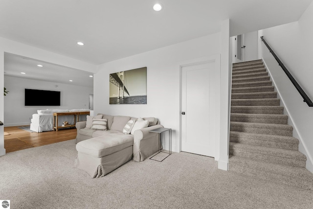 6848 S Carol Ann Dr, Traverse City, MI 49684 - carpeted living area with recessed lighting, stairs, and baseboards