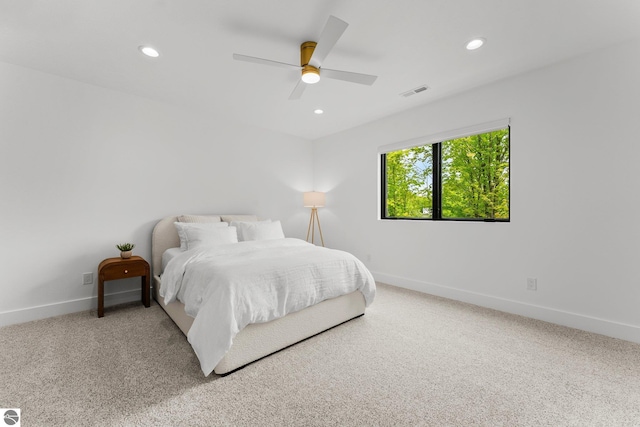 6848 S Carol Ann Dr, Traverse City, MI 49684 - carpeted bedroom featuring baseboards, recessed lighting, and ceiling fan