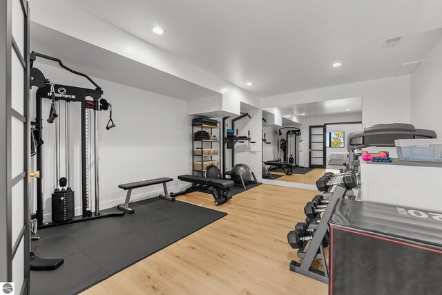 6848 S Carol Ann Dr, Traverse City, MI 49684 - workout room with wood finished floors and recessed lighting