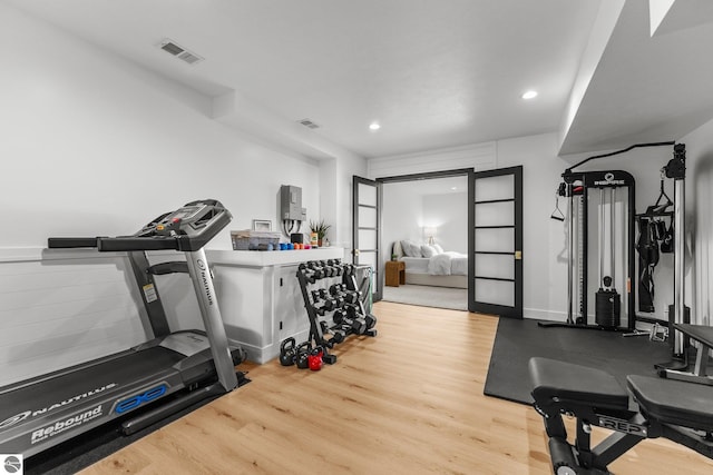 6848 S Carol Ann Dr, Traverse City, MI 49684 - workout area featuring wood finished floors and recessed lighting