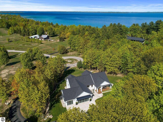 6848 S Carol Ann Dr, Traverse City, MI 49684 - aerial view of property's location featuring a nearby body of water and a heavily wooded area
