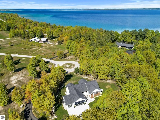 6848 S Carol Ann Dr, Traverse City, MI 49684 - aerial view of property and surrounding area featuring a heavily wooded area and a nearby body of water