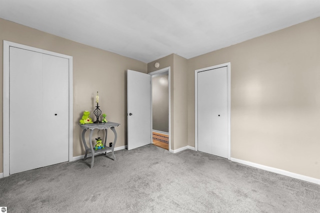 6148 S 27th Rd, Cadillac, MI 49601 - unfurnished bedroom with carpet floors and baseboards