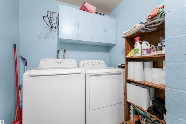 6148 S 27th Rd, Cadillac, MI 49601 - laundry room with washing machine and clothes dryer and cabinet space