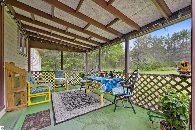 6148 S 27th Rd, Cadillac, MI 49601 - sunroom featuring view of wooded area and outdoor dining area