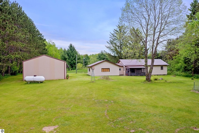 6148 S 27th Rd, Cadillac, MI 49601 - view of green lawn featuring a pole building and an outdoor structure