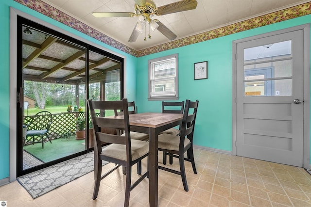 6148 S 27th Rd, Cadillac, MI 49601 - dining room with plenty of natural light, ceiling fan, light tile patterned floors, and baseboards