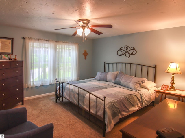 8086 Narrow Gauge Rd, Beulah, MI 49617 - carpeted bedroom featuring ceiling fan and baseboards