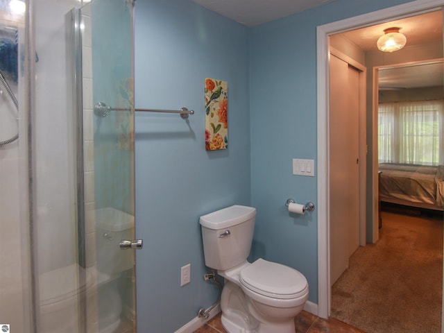 8086 Narrow Gauge Rd, Beulah, MI 49617 - full bath with ensuite bath, toilet, a shower with door, and baseboards