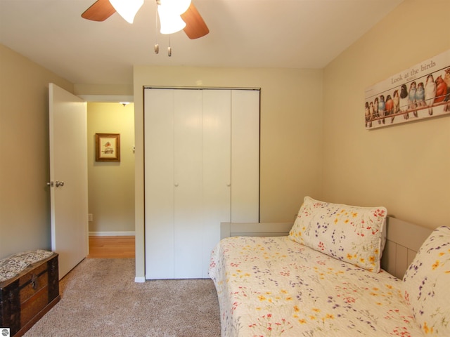8086 Narrow Gauge Rd, Beulah, MI 49617 - carpeted bedroom with a closet and ceiling fan