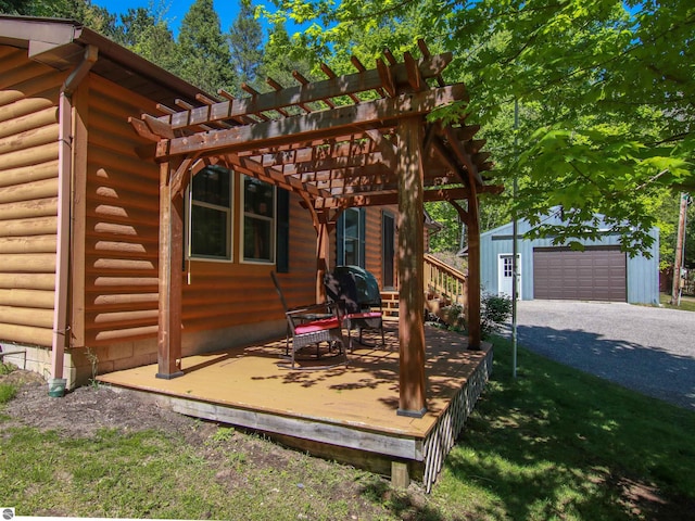 8086 Narrow Gauge Rd, Beulah, MI 49617 - wooden terrace featuring an outbuilding, a pergola, a detached garage, and grilling area