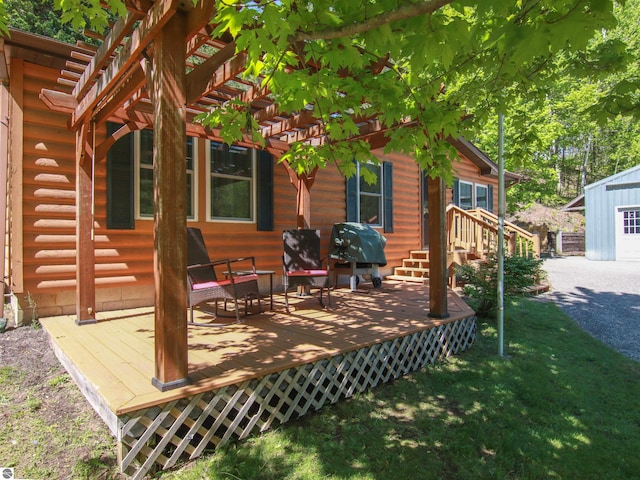 8086 Narrow Gauge Rd, Beulah, MI 49617 - wooden terrace with a yard and a pergola