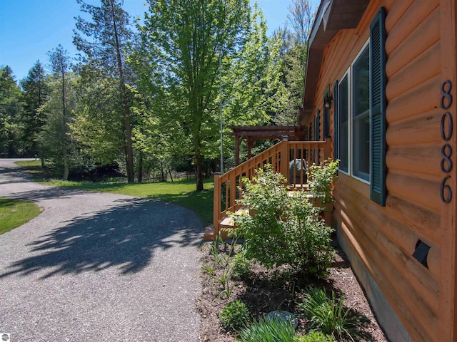 8086 Narrow Gauge Rd, Beulah, MI 49617 - view of side of property featuring a yard