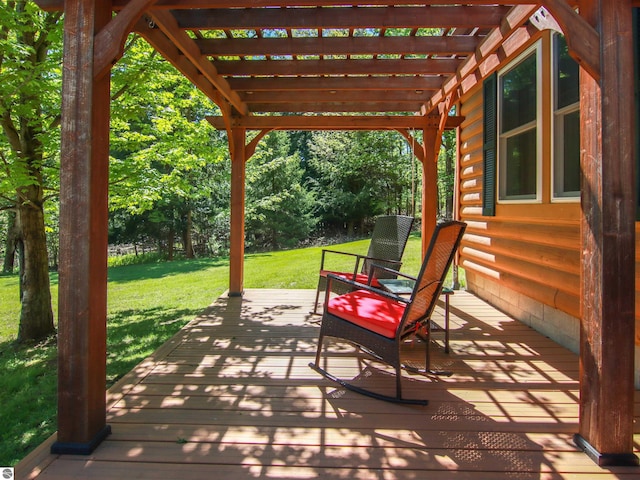 8086 Narrow Gauge Rd, Beulah, MI 49617 - wooden deck featuring a pergola and a lawn