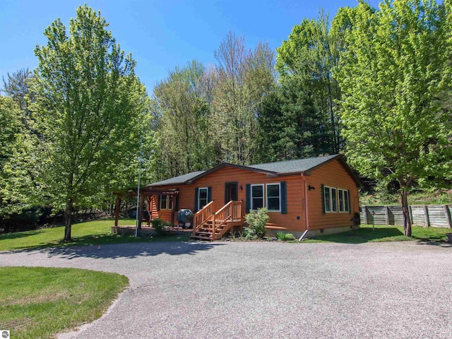 8086 Narrow Gauge Rd, Beulah, MI 49617 - rustic home featuring crawl space and driveway