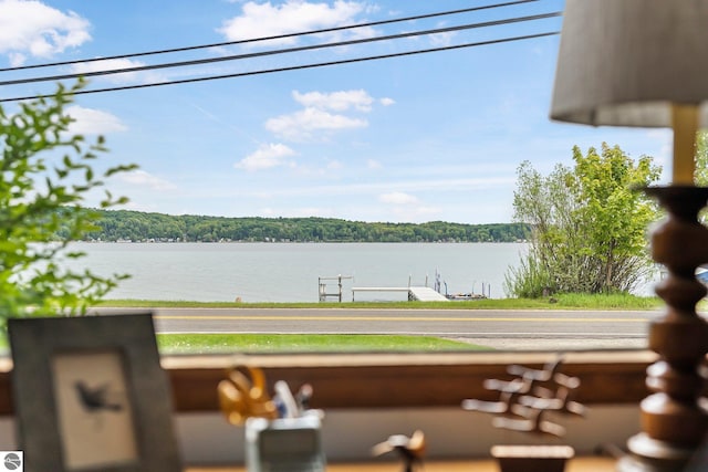 7510 Crystal Dr, Beulah, MI 49616 - water view with a boat dock and a forest