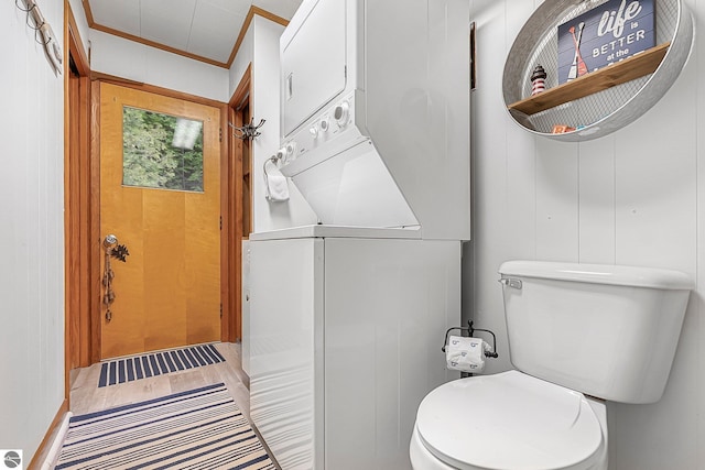 7510 Crystal Dr, Beulah, MI 49616 - half bathroom with toilet, crown molding, and wood finished floors