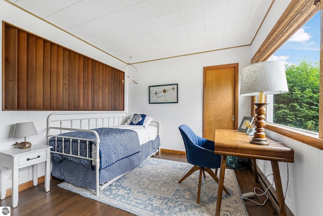 7510 Crystal Dr, Beulah, MI 49616 - bedroom with dark wood finished floors and baseboards