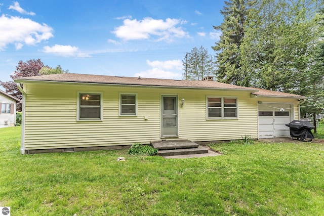 7510 Crystal Dr, Beulah, MI 49616 - rear view of house with a garage, crawl space, a lawn, and a chimney