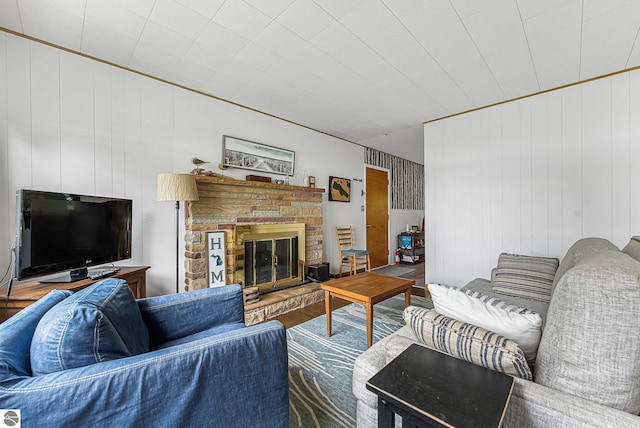 7510 Crystal Dr, Beulah, MI 49616 - living area with a glass covered fireplace, wood finished floors, and wooden walls