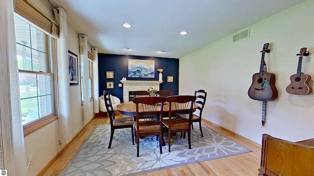 2152 Cornerstone Dr, Mount Pleasant, MI 48858 - dining area with light wood finished floors, recessed lighting, baseboards, and a fireplace