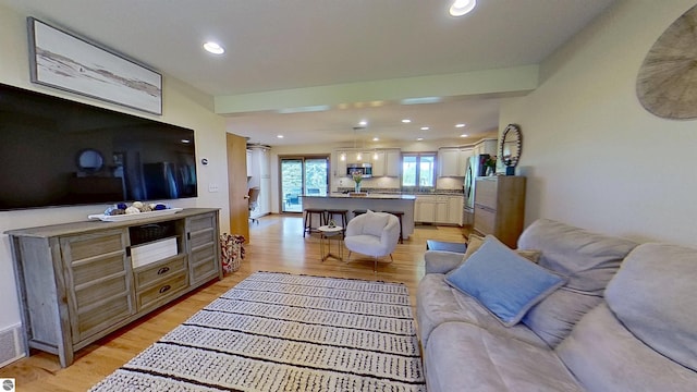 2152 Cornerstone Dr, Mount Pleasant, MI 48858 - living room featuring light wood-style floors and recessed lighting