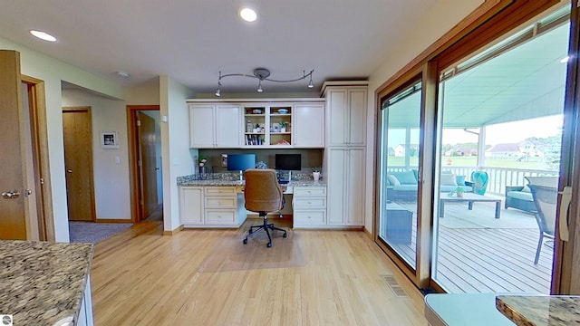 2152 Cornerstone Dr, Mount Pleasant, MI 48858 - office featuring built in desk, light wood finished floors, recessed lighting, and baseboards