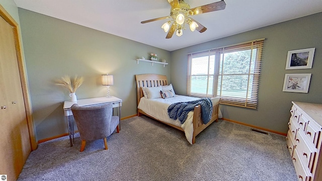 2152 Cornerstone Dr, Mount Pleasant, MI 48858 - bedroom with baseboards, carpet flooring, and a ceiling fan