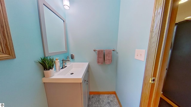 2152 Cornerstone Dr, Mount Pleasant, MI 48858 - bathroom featuring vanity and baseboards