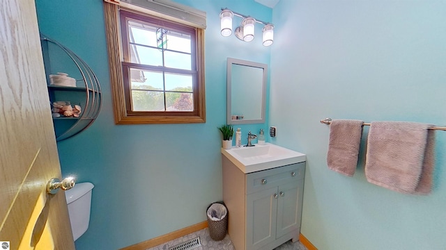 2152 Cornerstone Dr, Mount Pleasant, MI 48858 - bathroom with vanity, toilet, and baseboards