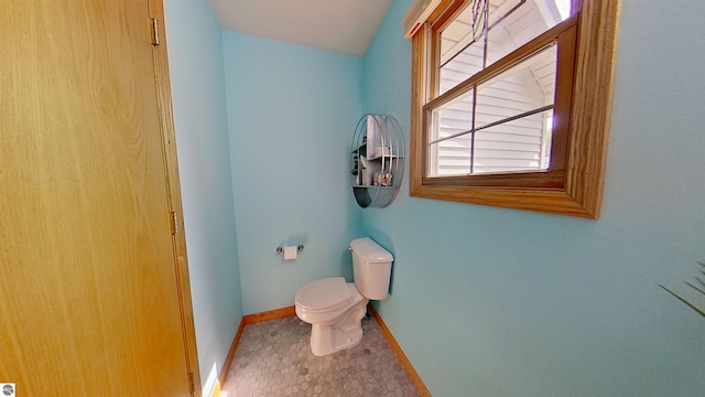2152 Cornerstone Dr, Mount Pleasant, MI 48858 - bathroom with toilet and baseboards