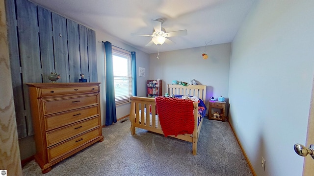 2152 Cornerstone Dr, Mount Pleasant, MI 48858 - bedroom featuring carpet, baseboards, and a ceiling fan