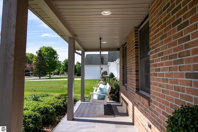 2152 Cornerstone Dr, Mount Pleasant, MI 48858 - covered porch featuring a yard