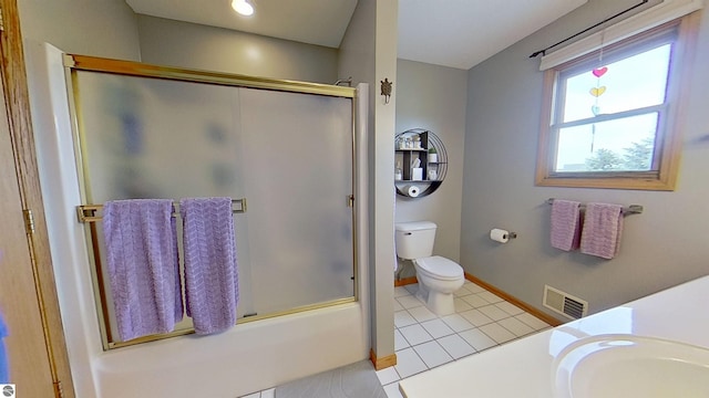 2152 Cornerstone Dr, Mount Pleasant, MI 48858 - bathroom with a shower with shower door, tile patterned floors, toilet, baseboards, and vanity