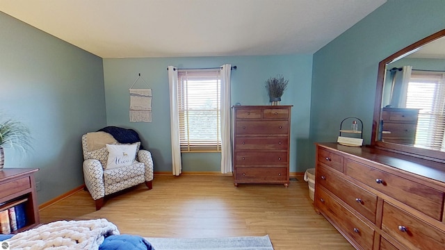 2152 Cornerstone Dr, Mount Pleasant, MI 48858 - living area with light wood-type flooring, healthy amount of natural light, and baseboards