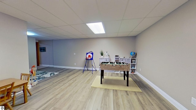 2152 Cornerstone Dr, Mount Pleasant, MI 48858 - recreation room featuring wood finished floors, baseboards, and a paneled ceiling