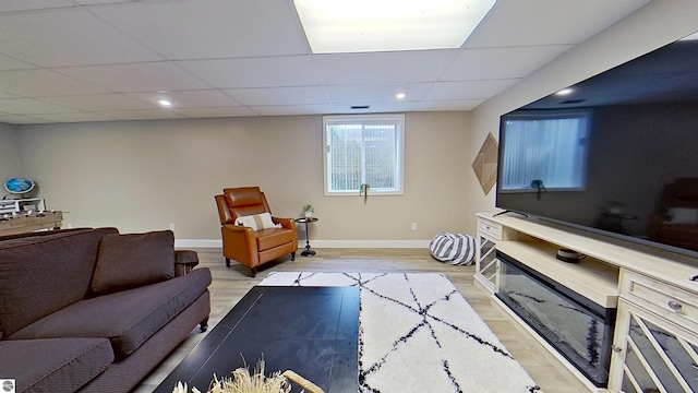 2152 Cornerstone Dr, Mount Pleasant, MI 48858 - living room with baseboards, wood finished floors, a drop ceiling, and recessed lighting