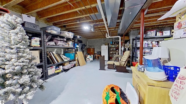 2152 Cornerstone Dr, Mount Pleasant, MI 48858 - unfinished basement featuring freestanding refrigerator