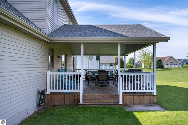 2152 Cornerstone Dr, Mount Pleasant, MI 48858 - wooden terrace featuring a lawn and outdoor dining area