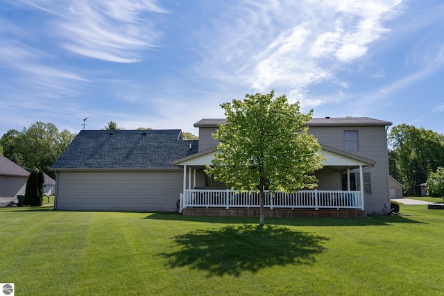 2152 Cornerstone Dr, Mount Pleasant, MI 48858 - rear view of house featuring a lawn and a porch