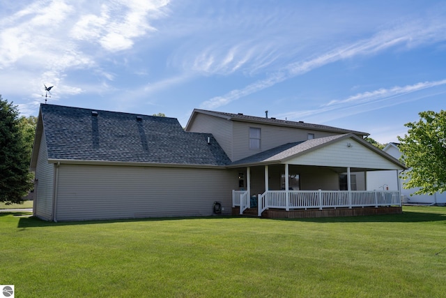 2152 Cornerstone Dr, Mount Pleasant, MI 48858 - rear view of property with a yard, a porch, and a shingled roof