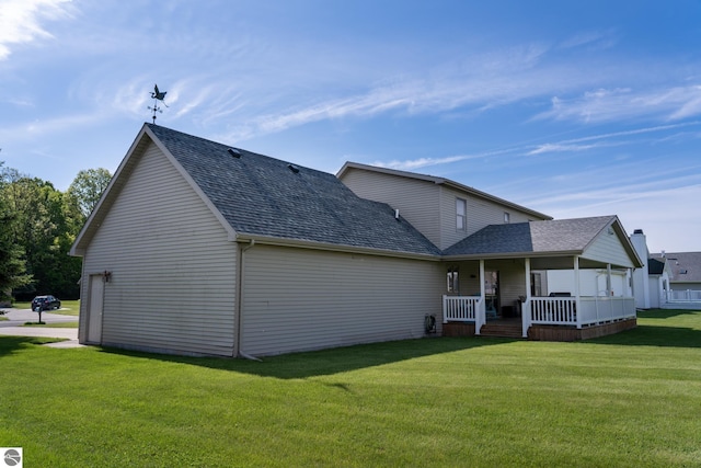 2152 Cornerstone Dr, Mount Pleasant, MI 48858 - rear view of property with covered porch, a shingled roof, and a yard