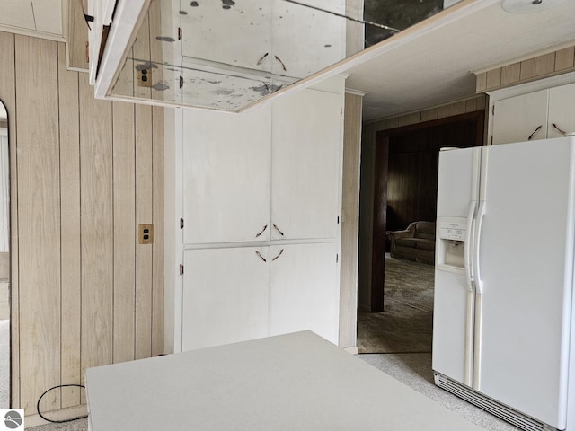 4451 Bissonette Rd, Oscoda, MI 48750 - interior space featuring white refrigerator with ice dispenser and wood walls