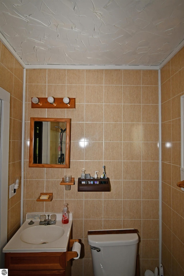 4327 S M-65, Glennie, MI 48737 - half bath featuring tile walls, vanity, and toilet