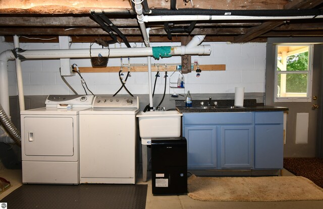 4327 S M-65, Glennie, MI 48737 - washroom featuring cabinet space, separate washer and dryer, and concrete block wall