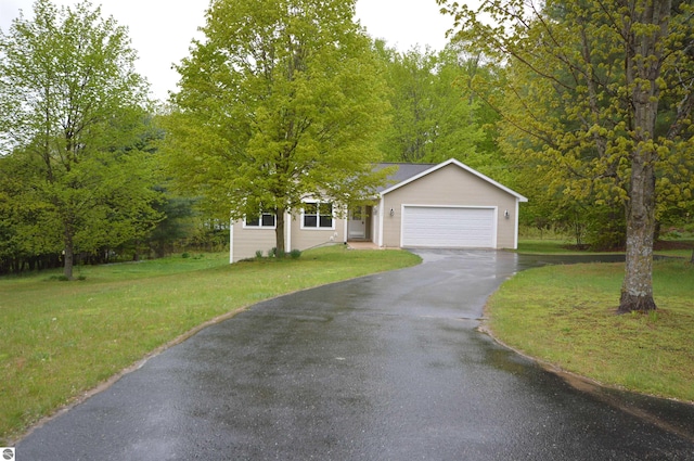 1433 Elk Run, Traverse City, MI 49696 - view of front of house featuring driveway, a garage, and a front yard