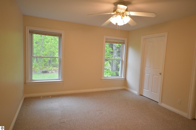 1433 Elk Run, Traverse City, MI 49696 - unfurnished room featuring light colored carpet and healthy amount of natural light